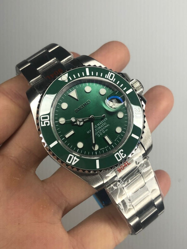 Customer holding a green dial dive watch mod
