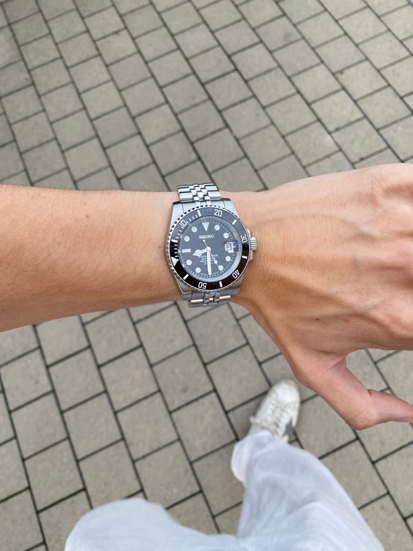 Customer wearing a black dial dive watch mod
